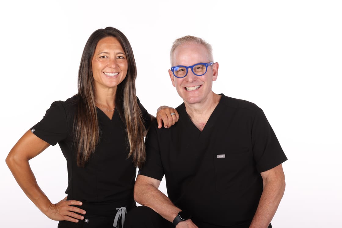 Dr. Jenée Kaplan and Dr. Sandy Bigman of Canyon Lakes Orthodontics, standing together in the San Ramon office.